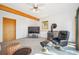 Relaxing living room with wood beam, wood burning stove and plenty of space for entertaining at 7350 Timber Trail Rd, Evergreen, CO 80439