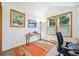 This office has a large window with natural light, and a bright colored rug at 7350 Timber Trail Rd, Evergreen, CO 80439
