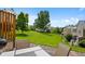 Enjoy the serene backyard with a patio and view of the lush, green community space at 9278 W Ontario Dr, Littleton, CO 80128