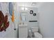 Stylish powder room with modern fixtures, a floating vanity, and unique decor at 9278 W Ontario Dr, Littleton, CO 80128