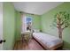 Cozy bedroom featuring hardwood floors, a work space, and a view of the outdoors at 9278 W Ontario Dr, Littleton, CO 80128