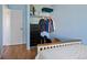 Bedroom featuring built in dresser, closet with rod, and storage shelf at 9278 W Ontario Dr, Littleton, CO 80128