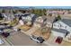 Aerial view of houses with solar panels and mountain backdrop at 12047 W Coal Mine Dr, Littleton, CO 80127