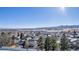 Wide shot of neighborhood with mountain views and houses at 12047 W Coal Mine Dr, Littleton, CO 80127