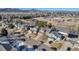 Aerial view of neighborhood with houses, school, and mountains at 12047 W Coal Mine Dr, Littleton, CO 80127