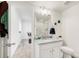Bright bathroom with granite vanity, tiled shower and stylish fixtures, plus added decor at 27986 E Frost Pl, Aurora, CO 80016