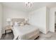 Inviting bedroom with soft gray carpet, a plush bed, and a large closet for ample storage at 27986 E Frost Pl, Aurora, CO 80016