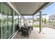 Inviting covered patio with comfortable seating, offering a relaxing outdoor space with views of the neighborhood at 27986 E Frost Pl, Aurora, CO 80016