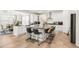 Open-concept kitchen with a large center island, sleek countertops, modern appliances, and ample cabinet space at 27986 E Frost Pl, Aurora, CO 80016
