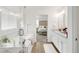 Luxurious main bathroom with a soaking tub, glass shower, and double vanity with granite countertop at 27986 E Frost Pl, Aurora, CO 80016