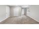 Carpeted basement boasts neutral walls, two closets, and a window at 6450 W 44Th Pl # B-3, Wheat Ridge, CO 80033