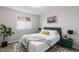 Inviting bedroom with ceiling fan, bright window, and neutral tones for a relaxing atmosphere at 6450 W 44Th Pl # B-3, Wheat Ridge, CO 80033