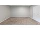 A spacious bedroom with a large closet and neutral colored carpet at 6450 W 44Th Pl # B-3, Wheat Ridge, CO 80033