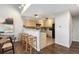 View of a dining room with a breakfast bar, stainless steel appliance at 6450 W 44Th Pl # B-3, Wheat Ridge, CO 80033