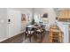 View of a dining room featuring new floors, modern fixtures and neutral paint at 6450 W 44Th Pl # B-3, Wheat Ridge, CO 80033