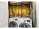 Bright laundry room featuring modern front loading washer and dryer at 6450 W 44Th Pl # B-3, Wheat Ridge, CO 80033