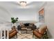 Bright living room featuring modern decor, stylish furniture, and an abundance of natural light at 6450 W 44Th Pl # B-3, Wheat Ridge, CO 80033