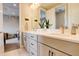Bright bathroom with double vanity sinks and stylish mirrors, perfect for a Gathering at 11142 Bright Sky St, Littleton, CO 80125