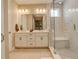 Elegant bathroom with double vanity, a glass-enclosed shower, and luxurious finishes at 11142 Bright Sky St, Littleton, CO 80125