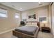 Cozy bedroom with natural light, neutral paint, and a simple, modern decor at 11142 Bright Sky St, Littleton, CO 80125
