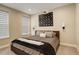 Serene bedroom featuring a plush bed, soft lighting, and stylish wall decor for relaxation at 11142 Bright Sky St, Littleton, CO 80125