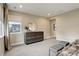 Comfortable bedroom with plush ottomans, a large dresser, and soft carpeting at 11142 Bright Sky St, Littleton, CO 80125
