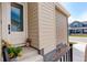 Inviting front porch with a stylish door and fresh flowers, enhancing curb appeal at 11142 Bright Sky St, Littleton, CO 80125