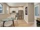 Bright kitchen with stainless steel appliances, white cabinets, and a cozy breakfast nook at 11142 Bright Sky St, Littleton, CO 80125