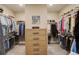 Spacious walk-in closet with custom shelving and drawers, perfect for organization at 11142 Bright Sky St, Littleton, CO 80125