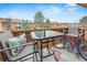 Cozy balcony with outdoor seating and string lights perfect for relaxing and enjoying the view at 3325 S Ammons St # 4-206, Lakewood, CO 80227