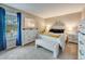 Cozy bedroom with plush carpeting, updated furnishings, and plenty of natural light at 3325 S Ammons St # 4-206, Lakewood, CO 80227