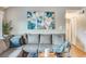 Comfortable living room showing sofa and artwork at 3325 S Ammons St # 4-206, Lakewood, CO 80227