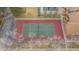 Aerial view of a tennis court with a manicured landscape surrounding it at 3325 S Ammons St # 4-206, Lakewood, CO 80227