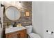 Charming half bathroom with wood paneled wall at 7171 Canyon Way, Frederick, CO 80504