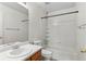 Simple, clean bathroom with a white vanity and tiled shower-tub combination at 7171 Canyon Way, Frederick, CO 80504