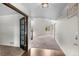 Bright entryway with hardwood floors, high ceilings, and a view into the spacious living area at 7171 Canyon Way, Frederick, CO 80504