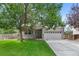 Charming brick home with a well-manicured lawn, covered porch, and a spacious two-car garage at 7171 Canyon Way, Frederick, CO 80504