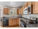 Kitchen with stainless appliances and a view from the window at 7171 Canyon Way, Frederick, CO 80504