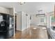 Open floor plan with refrigerator and view of living room at 7171 Canyon Way, Frederick, CO 80504
