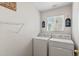 Bright laundry room featuring a washing machine and dryer at 7171 Canyon Way, Frederick, CO 80504