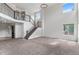 Bright living room with soaring ceilings, staircase, and views to the upper level at 7171 Canyon Way, Frederick, CO 80504