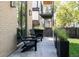 Relaxing outdoor seating area with modern black chairs, planters, and serene backyard views at 3934 Kalamath St, Denver, CO 80211