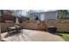Backyard with a paver patio, stone retaining wall, privacy fence, and an outdoor dining set at 2525 S Pennsylvania St, Denver, CO 80210