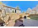 Backyard featuring a stone retaining wall, a privacy fence, a paver patio, and an outdoor dining set at 2525 S Pennsylvania St, Denver, CO 80210