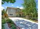 Charming two-story home with stone accents, well-kept landscaping, and a secure fenced yard at 2525 S Pennsylvania St, Denver, CO 80210