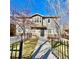 Charming home with a well-maintained front yard and inviting entrance, complemented by a black metal fence at 2525 S Pennsylvania St, Denver, CO 80210
