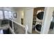 Second-floor hallway featuring the laundry closet, bathroom access and a window nook at 2525 S Pennsylvania St, Denver, CO 80210