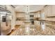 Spacious kitchen with stainless steel appliances, granite countertops, and custom cabinetry at 2525 S Pennsylvania St, Denver, CO 80210