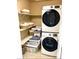 Laundry closet featuring a Samsung washer and dryer and plenty of shelving at 2525 S Pennsylvania St, Denver, CO 80210