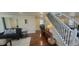 Open-concept living area featuring hardwood floors and staircase access at 2525 S Pennsylvania St, Denver, CO 80210